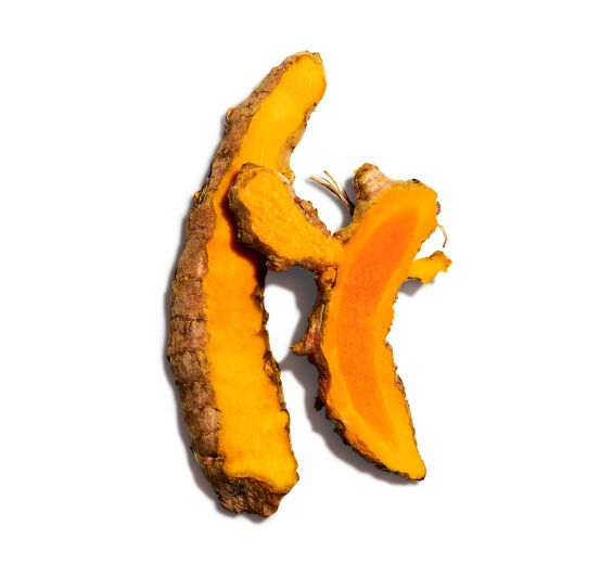 Turmeric root on a white background