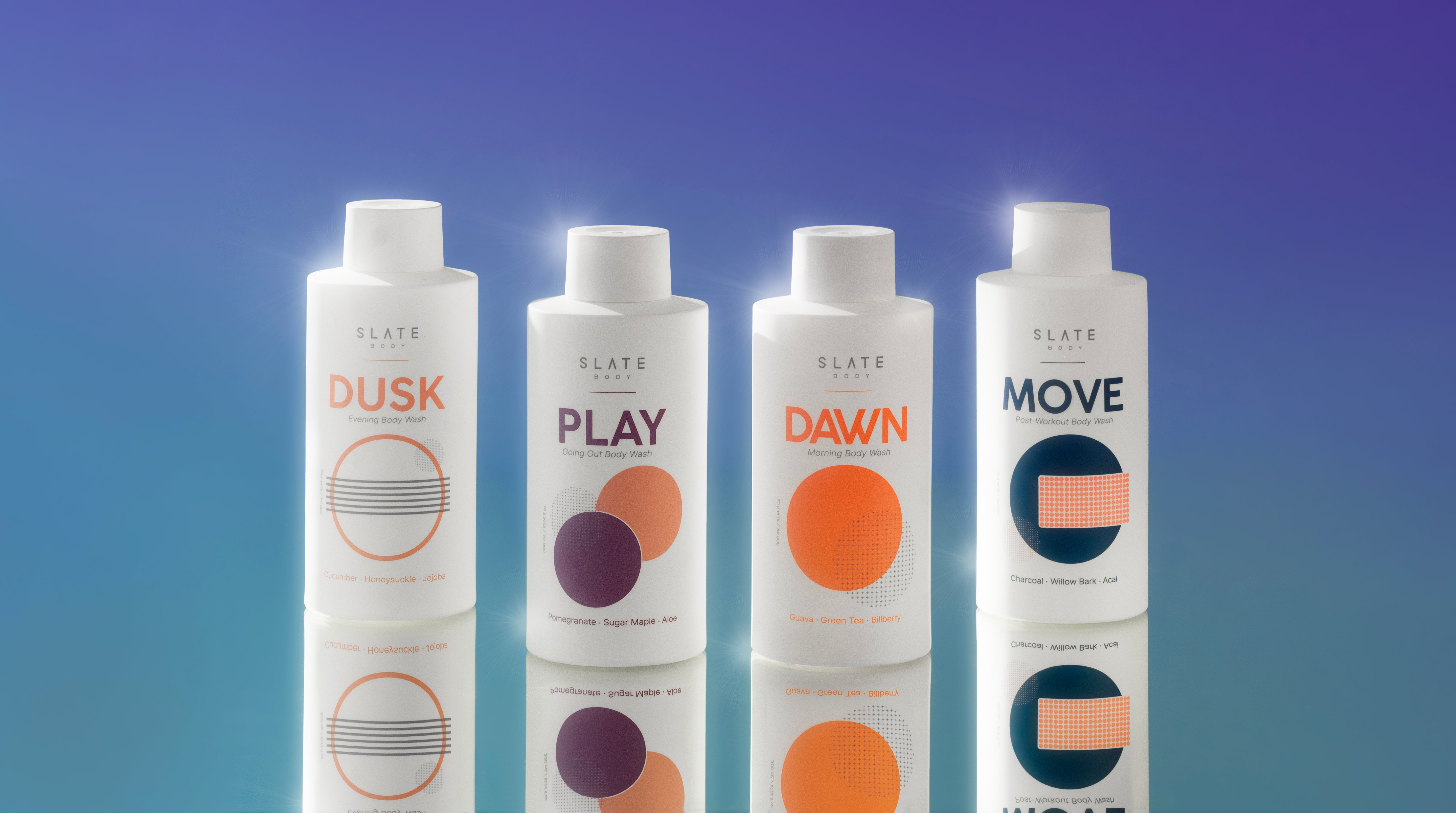 SLATE Body Wash collection featuring four bottles: Dusk (Evening), Play (Going Out), Dawn (Morning), and Move (Post-Workout) – natural ingredients like cucumber, pomegranate, guava, and charcoal – displayed on a blue gradient background