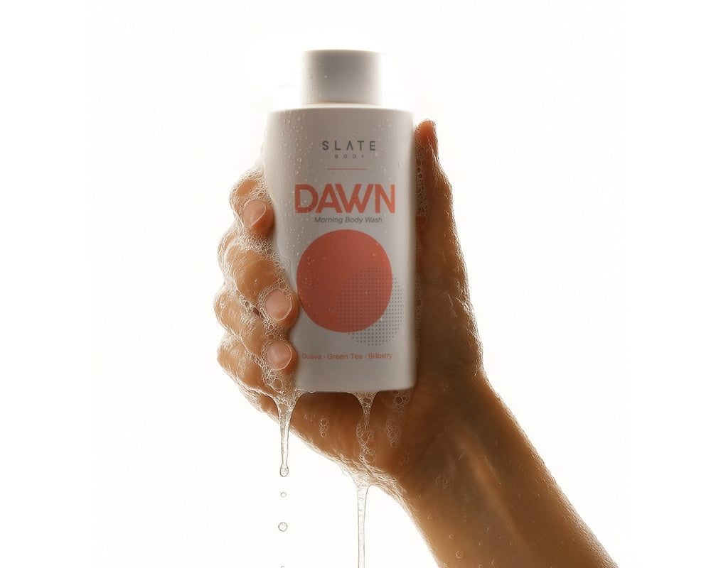 Experience the crisp splash of DAWN - shown mid-shower, this image captures its energising freshness. A premium sulfate-free and phthalates free body wash crafted for mornings that matter.