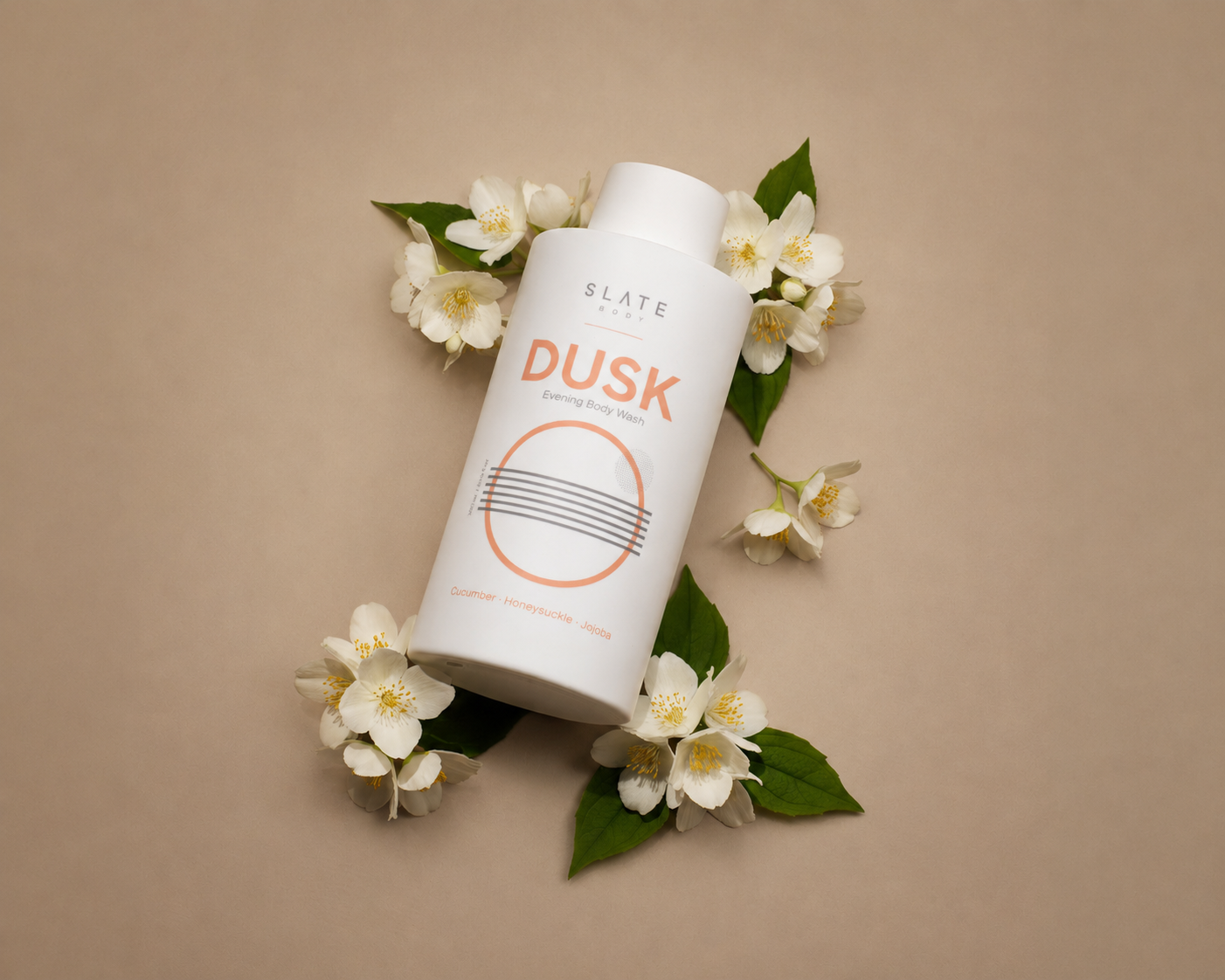 Bodycare product labeled 'DUSK' by Slate body with flowers on a beige background