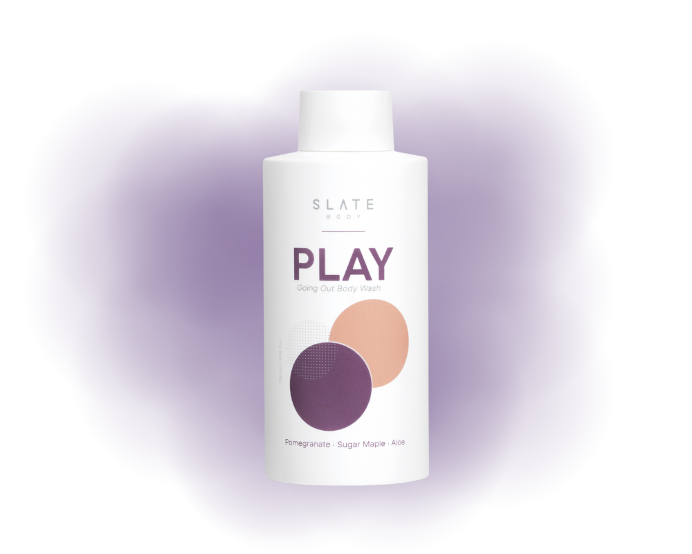 White bottle labeled 'SLATE PLAY' with Pomegranate, sugar maple and Aloe Vera