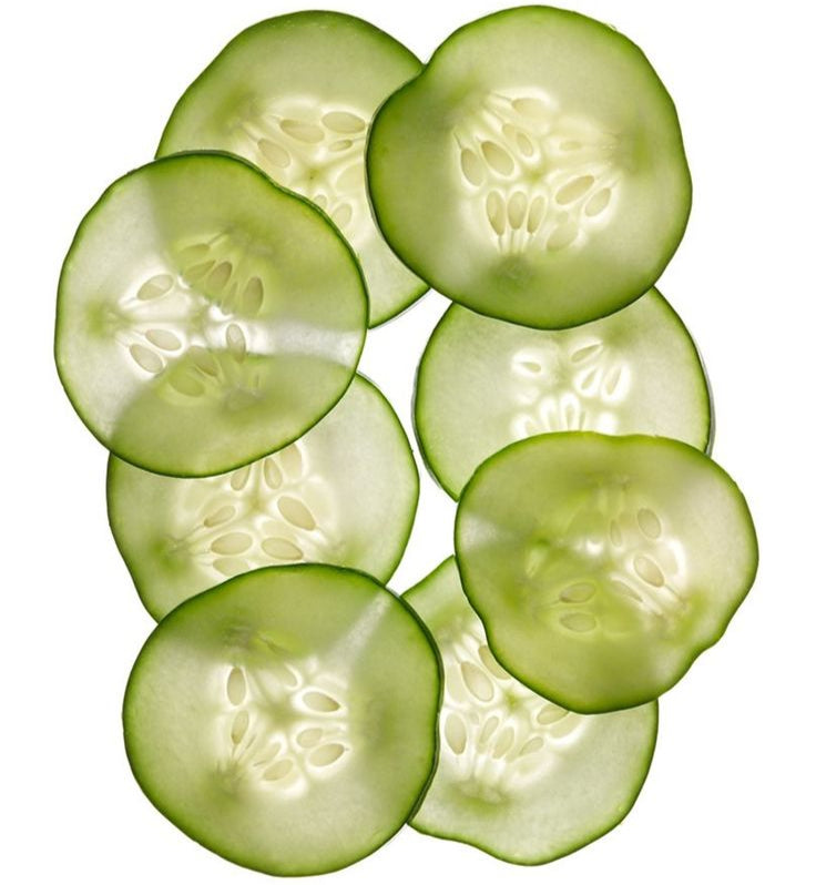 Sliced cucumbers arranged in a circular pattern on a white background